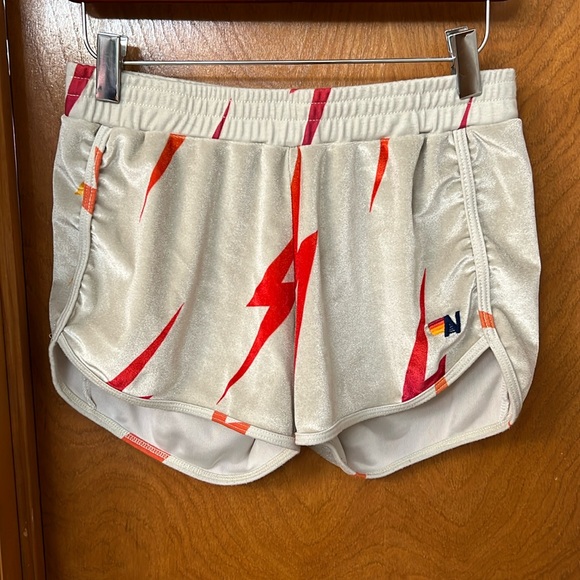 Aviator Nation Pants - Aviator Nation Ivory Lightning Bolt Running Shorts with Red & Orange Accents